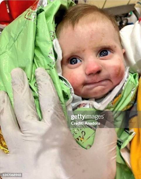 Capture from social media showing a new born baby rescued from under rubble 128 hours after 7.7 and 7.6 magnitude earthquakes hit multiple provinces...