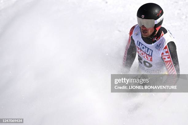 Canada's Cameron Alexander reacts after competing during the Men's Downhill event of the FIS Alpine Ski World Championship 2023 in Courchevel, French...