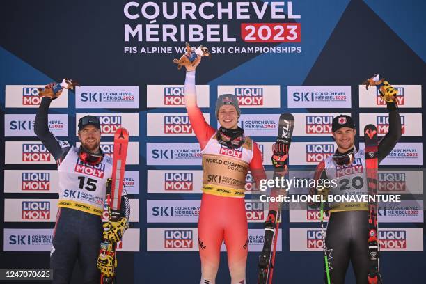 Second placed Norway's Aleksander Aamodt Kilde , first placed Switzerland's Marco Odermatt and third placed Canada's Cameron Alexander celebrate on...