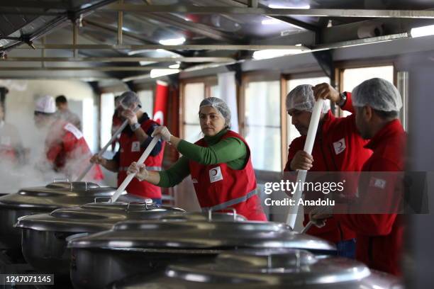 Turkish Red Crescent team members, who distribute hot meals to approximately 40 thousand earthquake victims daily, prepare hot meals in Diyarbakir,...