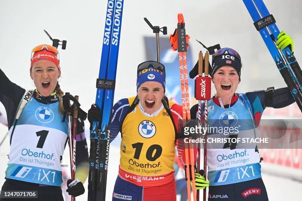 Second placed Germany's Denise Herrmann Wick, first placed France's Julia Simon and third placed Norway's Marte Olsbu Roeiseland celebrate after the...