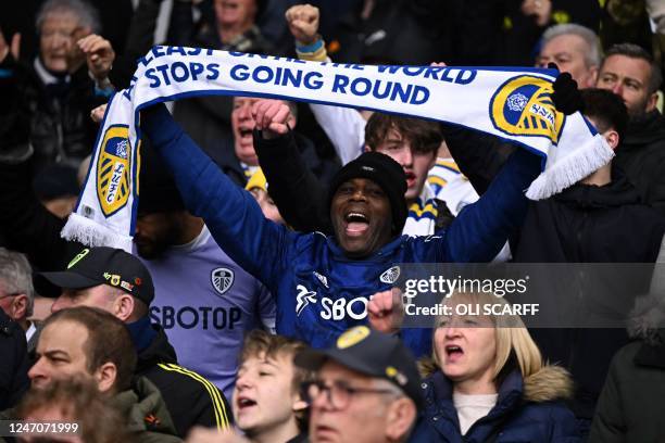 Leeds fan holds up a scarf in the crowd ahead of the English Premier League football match between Leeds United and Manchester United at Elland Road...