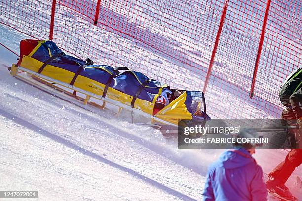 Canada's Brodie Seger is taken off the course with a stretcher after he crashed during the Men's Downhill event of the FIS Alpine Ski World...