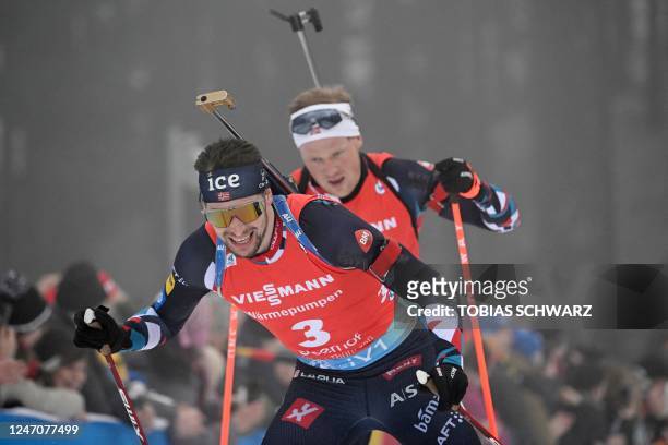Norway's Sturla Holm Laegreid competes ahead of Norway's Johannes Dale during the men's 12,5 km pursuit event of the IBU Biathlon World Championships...