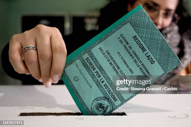 People vote in a polling station for the renewal of the office of President of the Region and of the Regional Council in the Lazio Region on February...