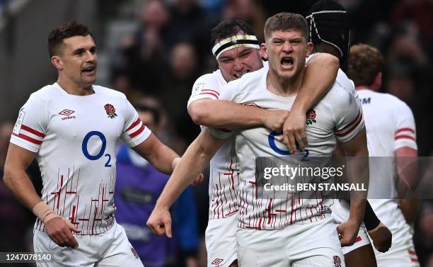 England's flanker Jack Willis celebrates after scoring the team's first try during the Six Nations international rugby union match between England...