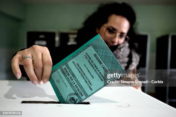 People vote in a polling station for the renewal of the office of President of the Region and of the Regional Council in the Lazio Region on February...