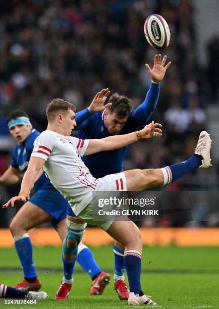 Italy's lock Federico Ruzza charges down a kick by England's scrum-half Jack van Poortlviet during the Six Nations international rugby union match...