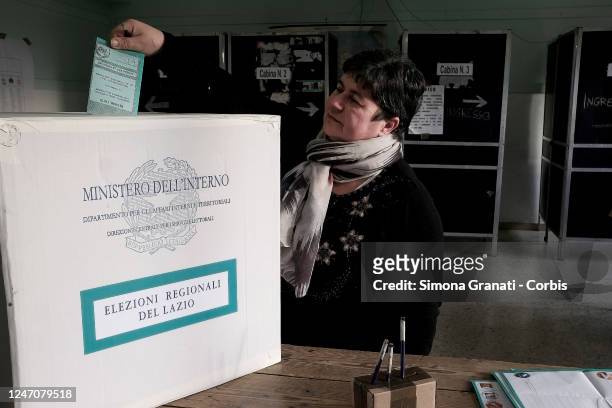 People vote in a polling station for the renewal of the office of President of the Region and of the Regional Council in the Lazio Region ,on...