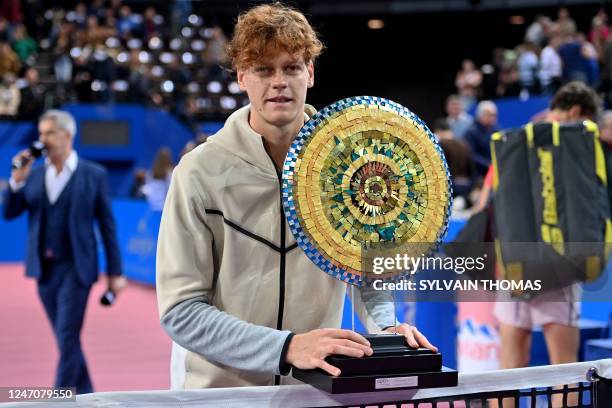 Italy's Jannik Sinner poses with the winner's trophy after winning the Open Sud de France ATP World Tour tennis tournament final in Montpellier on...