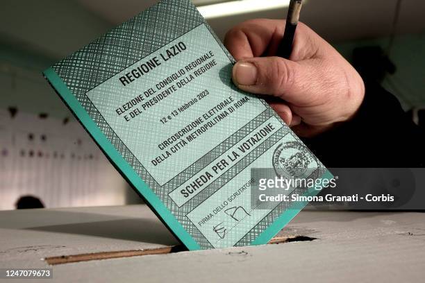 People vote in a polling station for the renewal of the office of President of the Region and of the Regional Council in the Lazio Region ,on...