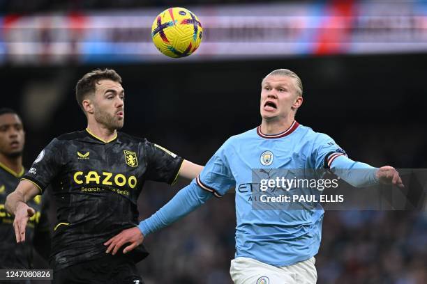 Manchester City's Norwegian striker Erling Haaland vies with Aston Villa's English defender Calum Chambers during the English Premier League football...