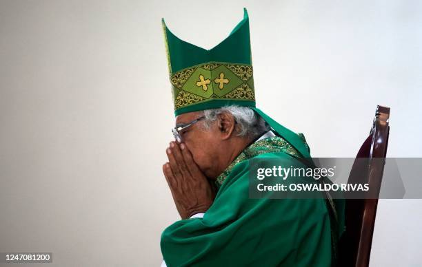 Nicaraguan Cardinal Leopoldo Brenes prays during a mass at the Metropolitan Cathedral in Managua, Nicaragua on February 12, 2023. - Brenes asked for...