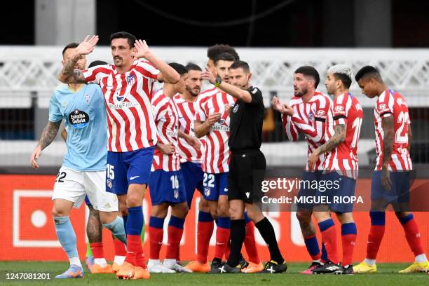 Atletico Madrid's Montenegrin defender Stefan Savic leaves after receiving a red card during the Spanish League football match between RC Celta de...