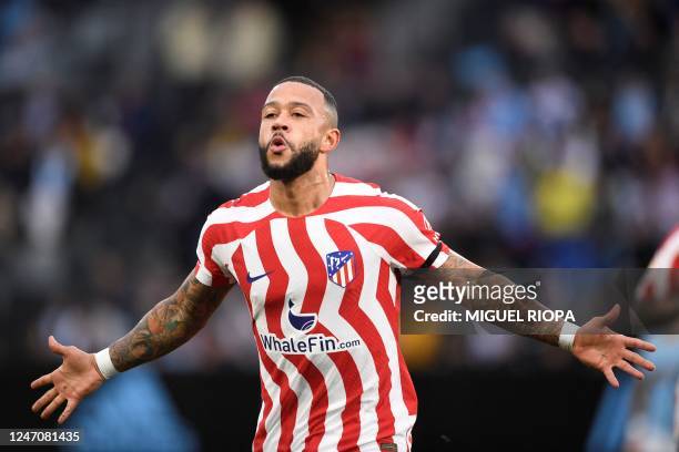 Atletico Madrid's Dutch forward Memphis Depay celebrates after scoring his team's first goal during the Spanish League football match between RC...