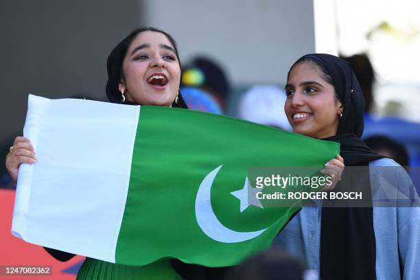 Pakistan supporters cheer during the Group B T20 women's World Cup cricket match between India and Pakistan at Newlands Stadium in Cape Town on...