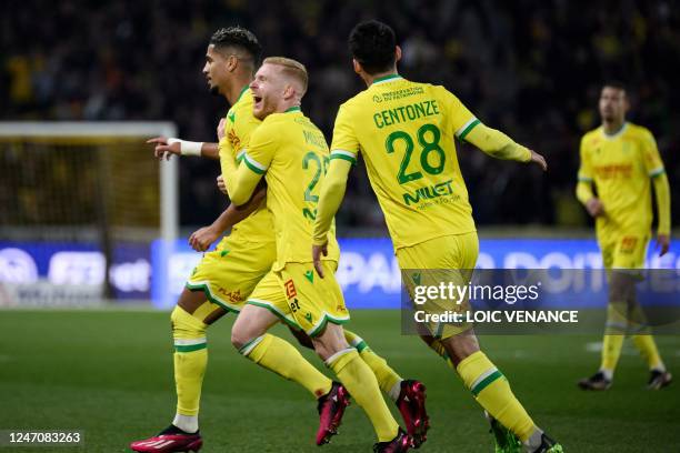 Nantes' French midfielder Ludovic Blas celebrates with team mates after scoring a goal during the French L1 football match between FC Nantes and FC...