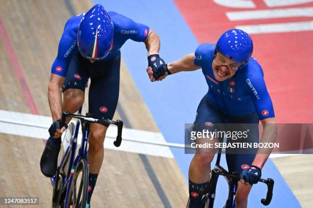 Italy's Michele Scartezzini and Italys Simone Consonni compete in the mens Madison final during during the UEC Track Elite European Championship in...