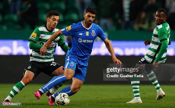 Mehdi Taremi of FC Porto with Pedro Goncalves of Sporting CP and Fatawu Issahaku of Sporting CP in action during the Liga Bwin match between Sporting...