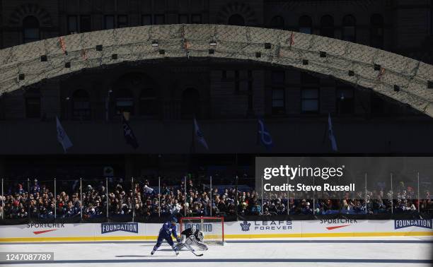 Toronto Maple Leafs defenseman Jordie Benn goes to background as the Toronto Maple Leafs take the subway to City Hall for their annual outdoor...