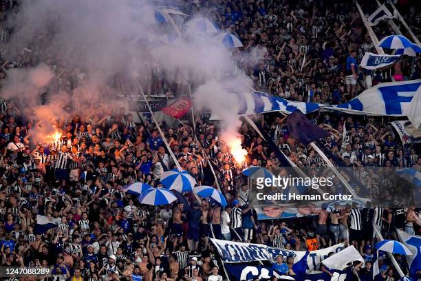 Fans of Talleres cheer for their team before a match between Talleres and Boca Juniors as part of Torneo Liga Profesional 2023 at Mario Alberto...