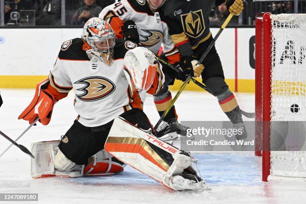 John Gibson of the Anaheim Ducks is scored on by Paul Cotter of the Vegas Golden Knights in the first period at T-Mobile Arena on February 12, 2023...