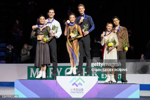 Dance gold medalists Madison Chock and Evan Bates, of the United States , stand for pictures with silver medalists Laurence Fournier Beaudry and...