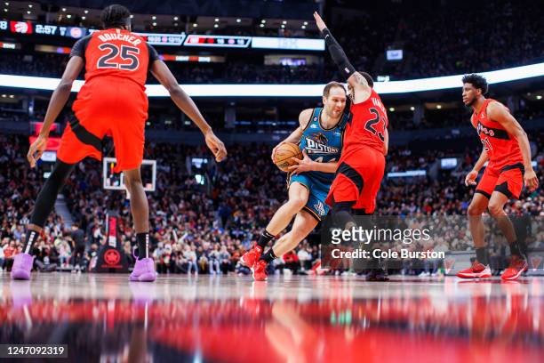 Bojan Bogdanovic of the Detroit Pistons drives to the net against Fred VanVleet of the Toronto Raptors during the second half of their NBA game at...