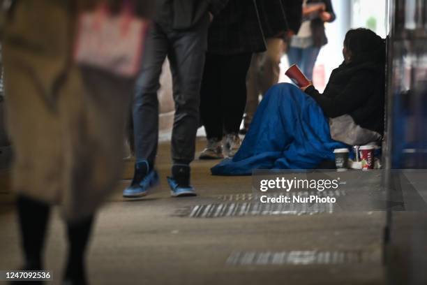 Person begging in the street of the city center of Dublin, Ireland, on February 12, 2023.