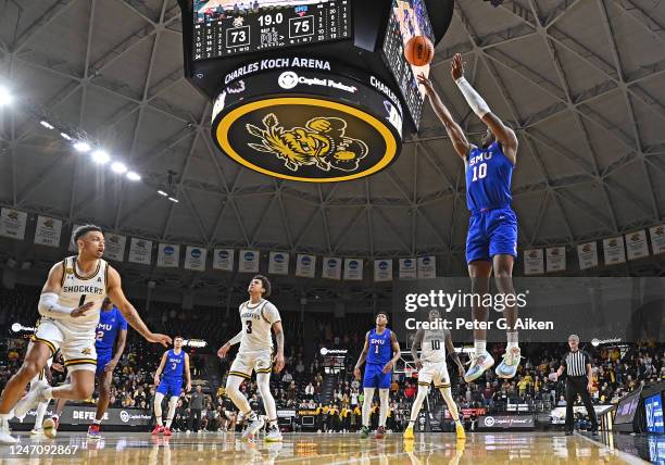 Zach Nutall of the Southern Methodist Mustangs shoots the ball against Xavier Bell of the Wichita State Shockers during a game in the second half at...