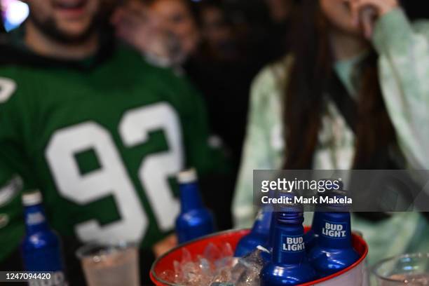 Philadelphia Eagles fans drink Bud Light while watching Super Bowl LVII at City Tap House on February 12, 2023 in Philadelphia, Pennsylvania. The...