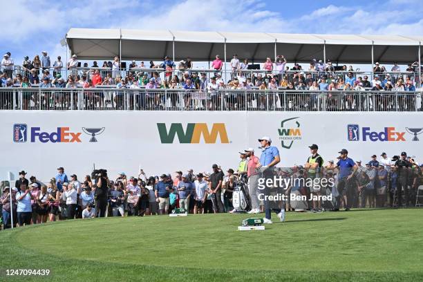 Scottie Scheffler watches his shot on the 12th hole during the final round of the WM Phoenix Open at TPC Scottsdale on February 12, 2023 in...
