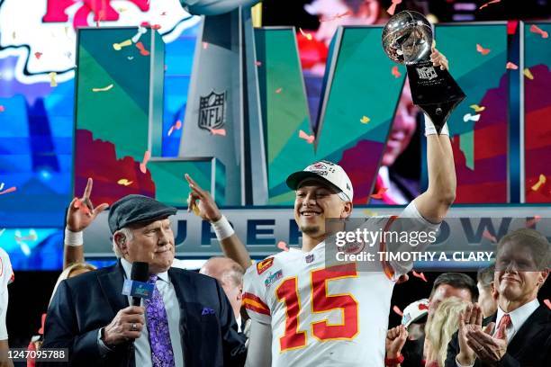 Retired football player Terry Bradshaw and Chief's owner Clark Hunt watch Kansas City Chiefs' quarterback Patrick Mahomes as he celebrates his team's...