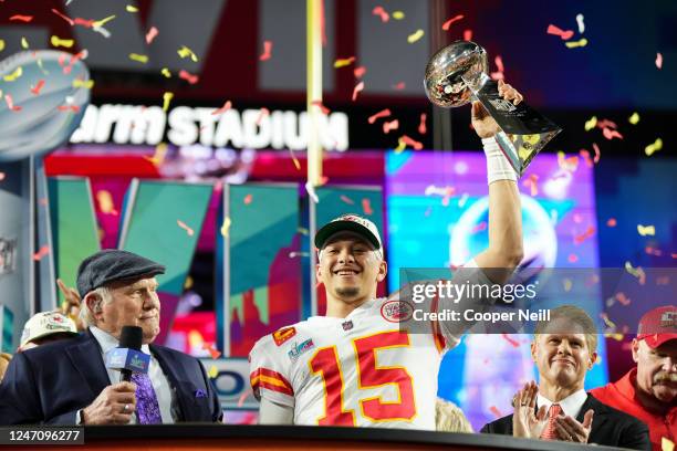 Patrick Mahomes of the Kansas City Chiefs hoists the Lombardi Trophy after Super Bowl LVII against the Philadelphia Eagles at State Farm Stadium on...