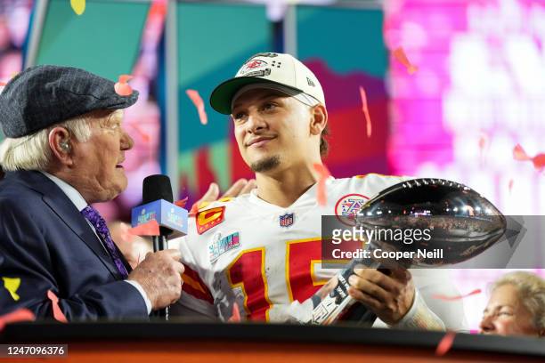 Patrick Mahomes of the Kansas City Chiefs hoists the Lombardi Trophy after Super Bowl LVII against the Philadelphia Eagles at State Farm Stadium on...