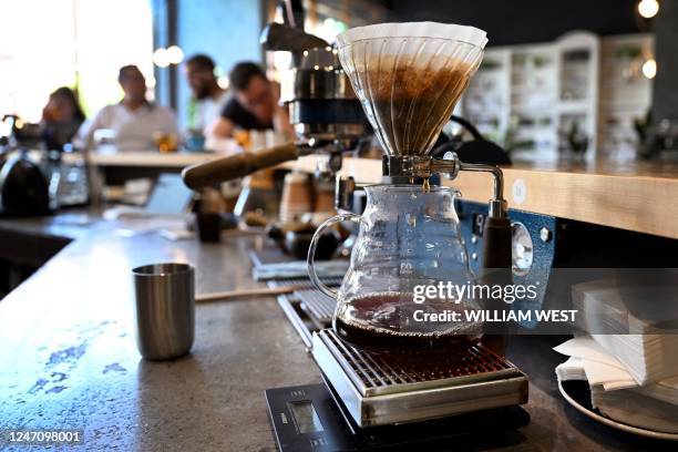 This photo taken on February 9, 2023 shows coffee being filtered at the Proud Mary cafe in Melbourne. At 140 USD a pop, one cafe in Melbourne,...