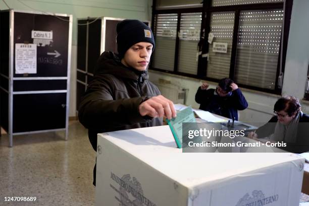 Young man casts his vote in a polling station for the renewal of the office of President of the Region and of the Regional Council in the Lazio...