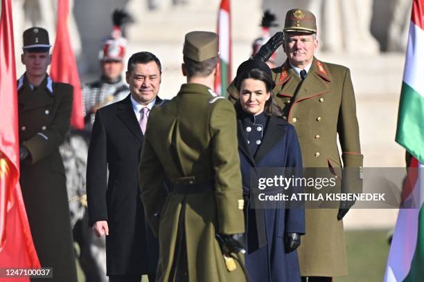 Hungarian President Katalin Novak and the Kyrgyz President Sadyr Japarov stand prior to their national anthems during a welcome ceremony in front of...