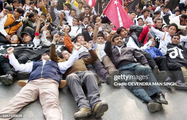 Leftist students block a busy street in Kathmandu during a protest against price hikes for petrol and cooking gas 24 November 2002. The cost of...