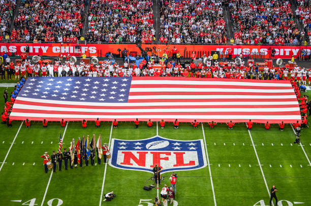 The American flag is displayed ahead of Super Bowl LVII between the Kansas City Chiefs and the Philadelphia Eagles held at State Farm Stadium in...