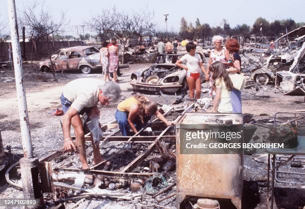 Relatives of victims search for personal belongings 12 July 1978 at "Los Alfaques" campsite devastated at 03 pm 11 July 1978 by a propane gas...