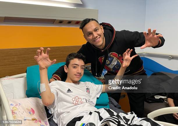 Besiktas player Josef de Souza gifts his signed jersey to 13-year-old Arda Can Ovun, who rescued under rubble 128 hours after 7.7 earthquake in...