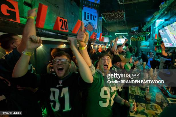 Philadelphia Eagles fans react as they watch their team play in Super Bowl LVII at Tinsel Takes Flight, a pop-up bar in Philadelphia, Pennsylvania on...
