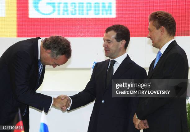 Chairman of German natural-gas utility E.ON Rurhgas AG, Bernhard Reutersberg shakes hands with Russian President Dmitry Medvedev after signing an...