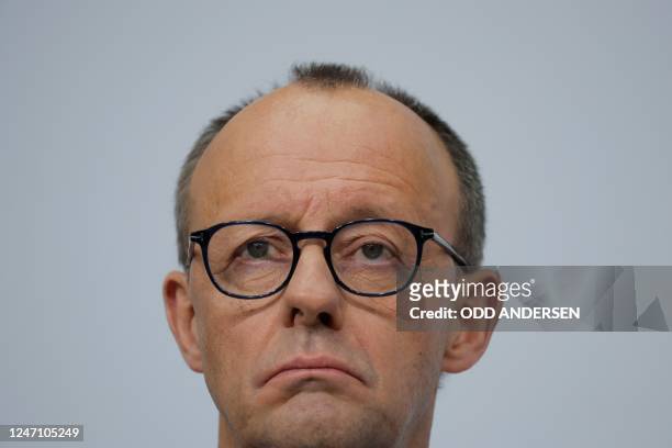 Leader of Germany's conservative Christian Democratic Union party Friedrich Merz looks on during a joint press conference with the party's top...