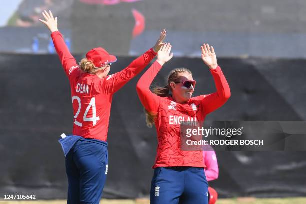 England's Sophie Ecclestone celebrates with teammate England's Charlie Dean after the dismissal of Ireland's Eimear Richardson during the Group B T20...