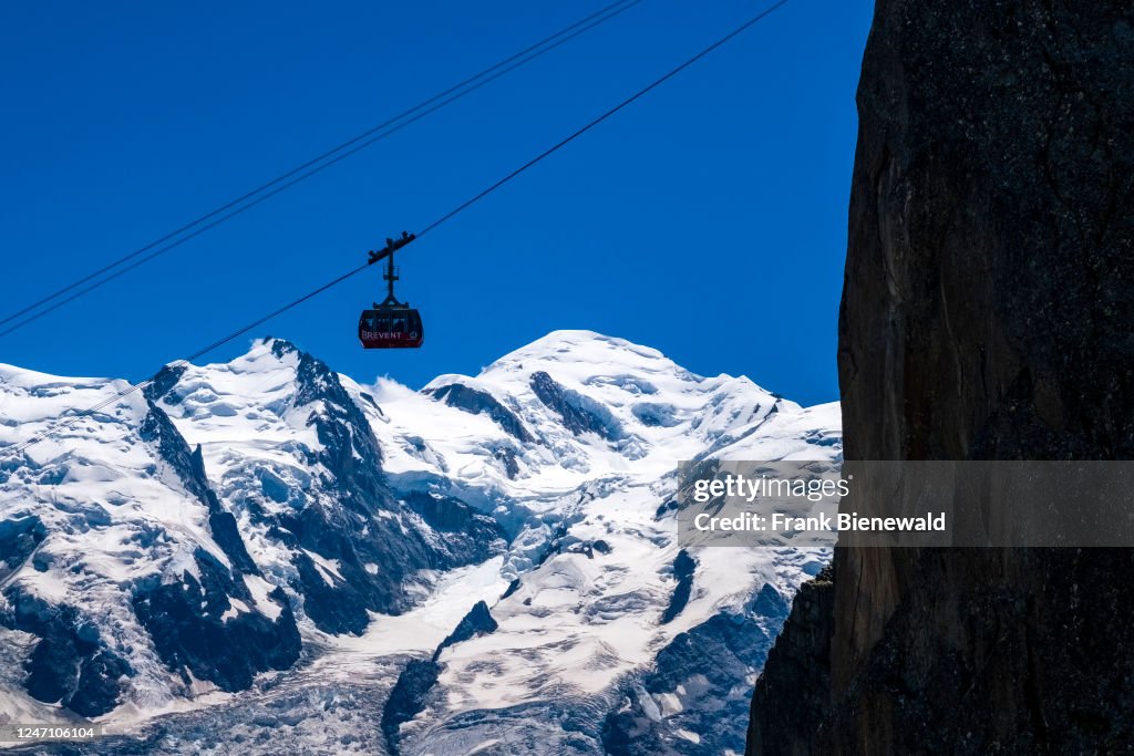 The summit of Mont Blanc and the Bossons Glacier, a gondola...