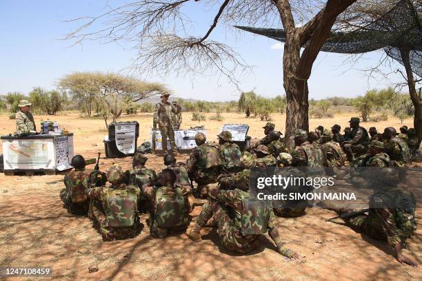 Army soldiers display explosives munitions, as they offer training to Kenya Defence Forces soldiers during training at the Justified Accord...