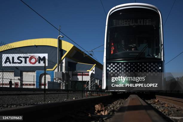 An Alstom employee sits in the Citadis XO5 tramway during a demonstration ride at the Alstom plant in La Rochelle, western France, on February 13,...