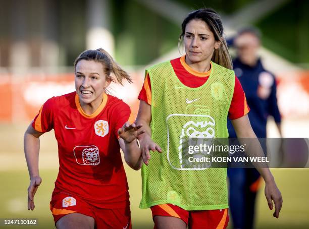 Netherland's midfielders Jackie Groenen and Danielle Van De Donk attend a training session in Amsterdam, on February 13 prior to two friendly matches...